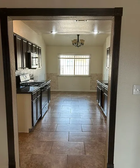 kitchen entrance with dining room in back. Granite countertops