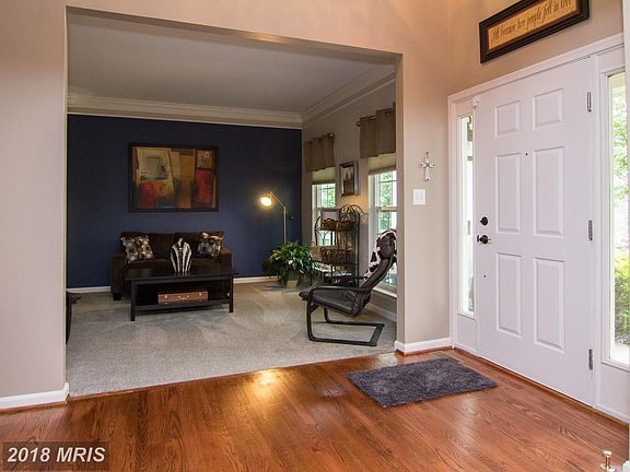 Foyer/Refinished wood flooring.