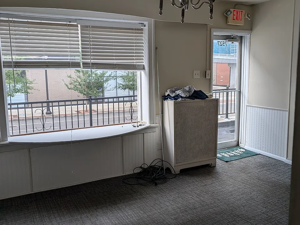 Front Room with natural light from glass door and window