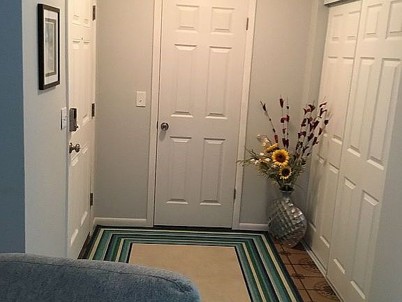 Foyer with walk in storage