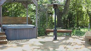 Back yard and hot tub in the summer
