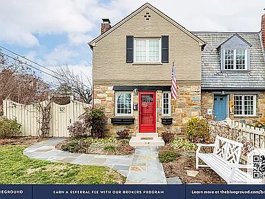 front of home - end unit of townhouse, with privately fenced back, front and side yard.