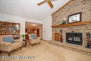 Main floor family room with vaulted ceiling and fireplacae