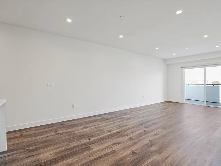 Large-Size Living Room with Recessed Lighting, Vinyl Flooring, and Patio