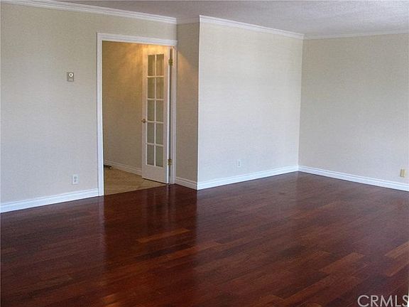 Wide open layout with TONS of light, crown molding and mahogany floors