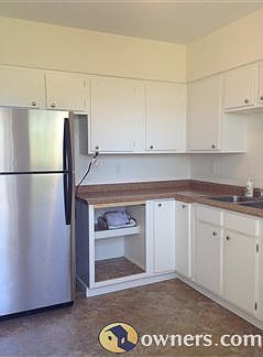Kitchen with stainless steel fridge