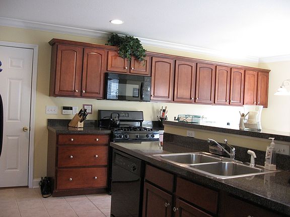 Ceramic floors/cherry cabinetry