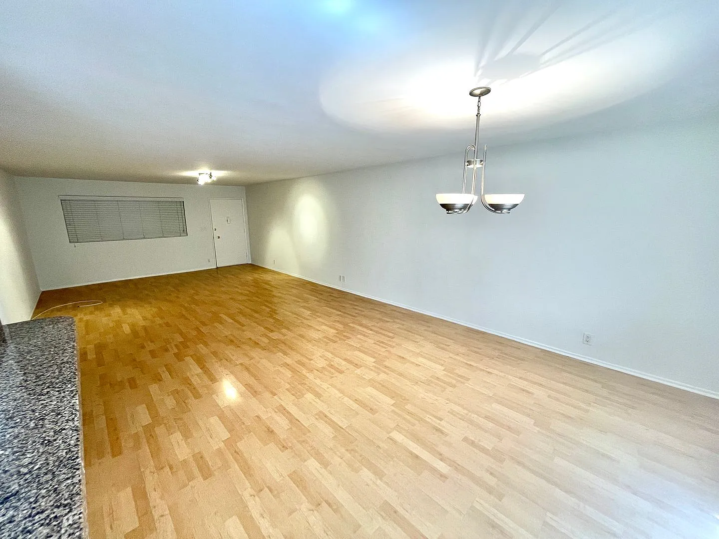 A beautiful lower unit with lots of storage, one covered parking and combo washer/dryer — Photo 1