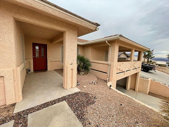 front entry plus side entry, and large wrap around master suite covered patio