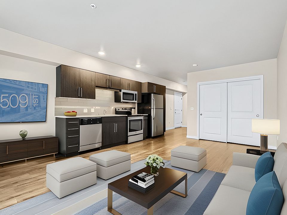 Comfortable open concept living that flows into a sleek kitchen.