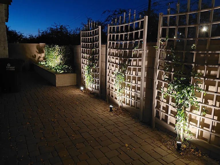 Backyard with night lighting reverse view