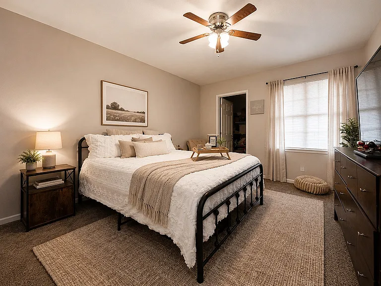 Cozy bedroom with carpet & ceiling fan