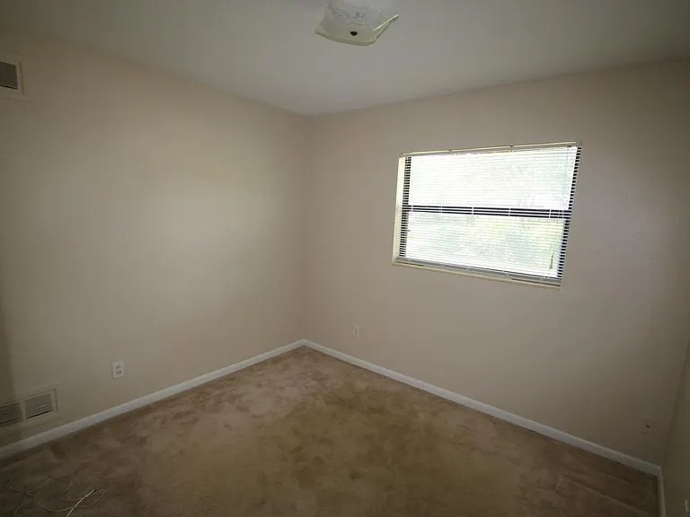 Bedroom, LVT tile now not carpet. Also has a ceiling fan currently.
