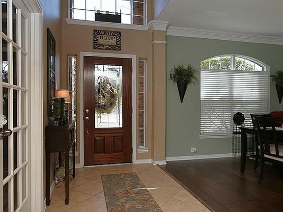 Beautiful Leaded glass door with sidelights is a fabulous entrance to foyer of this move-in ready ho