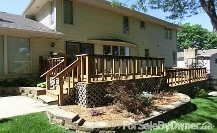 2-Tier deck. Flower beds have perennials. Backyard has 2 mature trees.