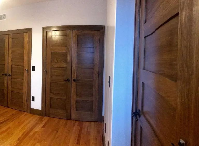 bedroom with three closets