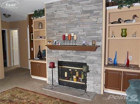 Natural fireplace with build in bookshelves.  Vaulted ceilings in the livingroom
