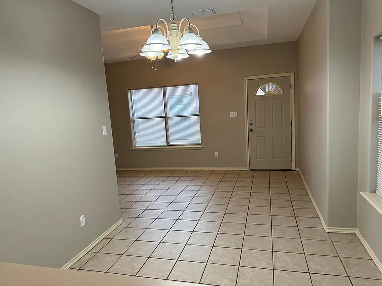 From kitchen looking at dining area and front door.