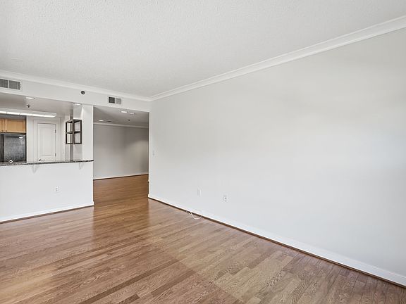Open Living and Dining Area with Hardwood Flooring