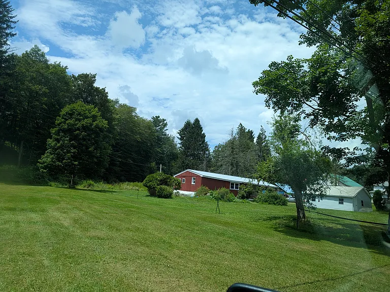 There are no neighbors on the south side. Neighboring owner keeps his lot mowed. View is over neighboring lot.
