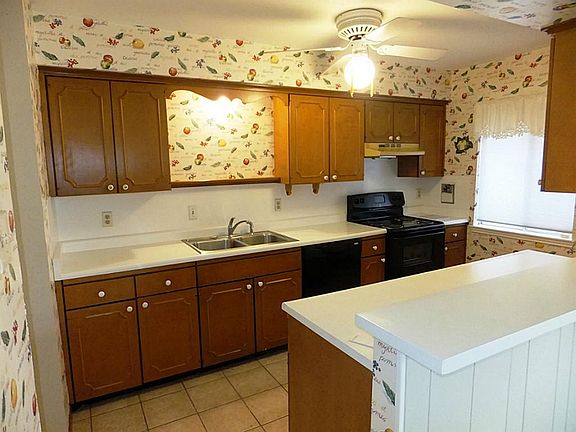 The kitchen has a recently upgraded dishwasher and stove. There is also a new water heater.