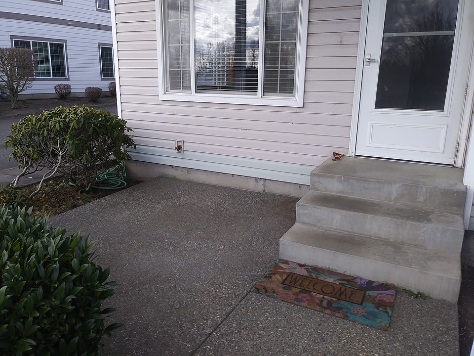 Front door entry way with cute patio area for you to sit outside