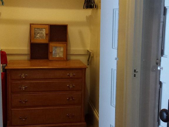 Spacious closet located between kitchen and back door