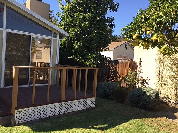 View of rear deck, avocado tree and grapefruit tree