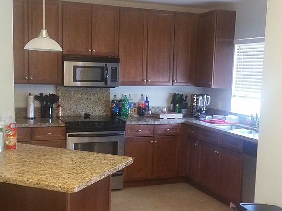 beautiful large kitchen with granite countertops, stainless