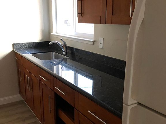 Kitchen counter with window facing driveway