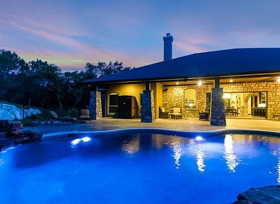 Don't miss the 21-foot extended glass pocket sliders that open to access the pool area!