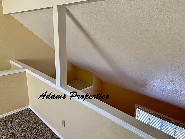 loft area above larger bedroom