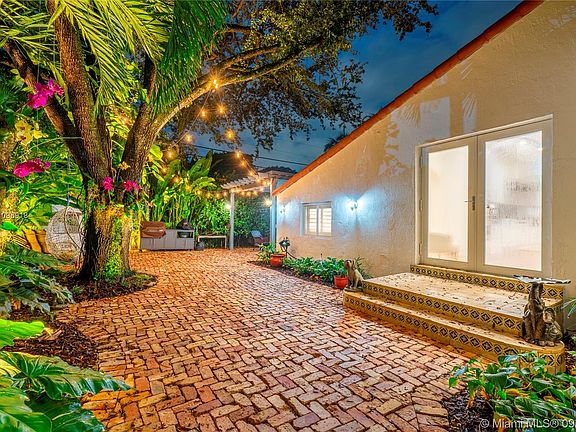 Brick Courtyard with Landscape Lighting.