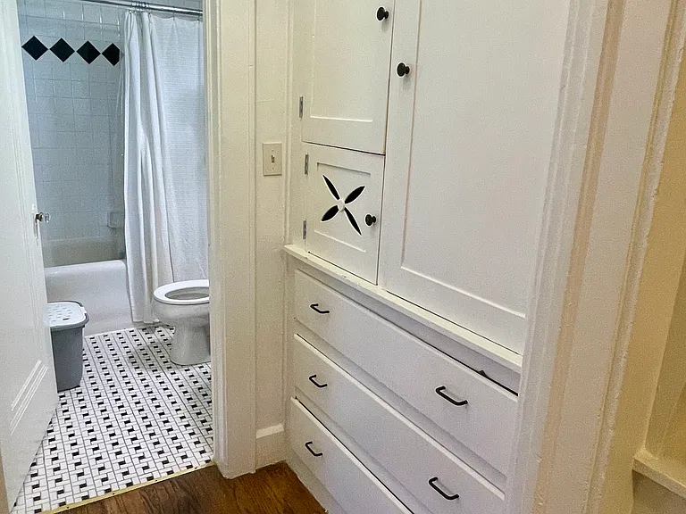Hallway storage into bathroom