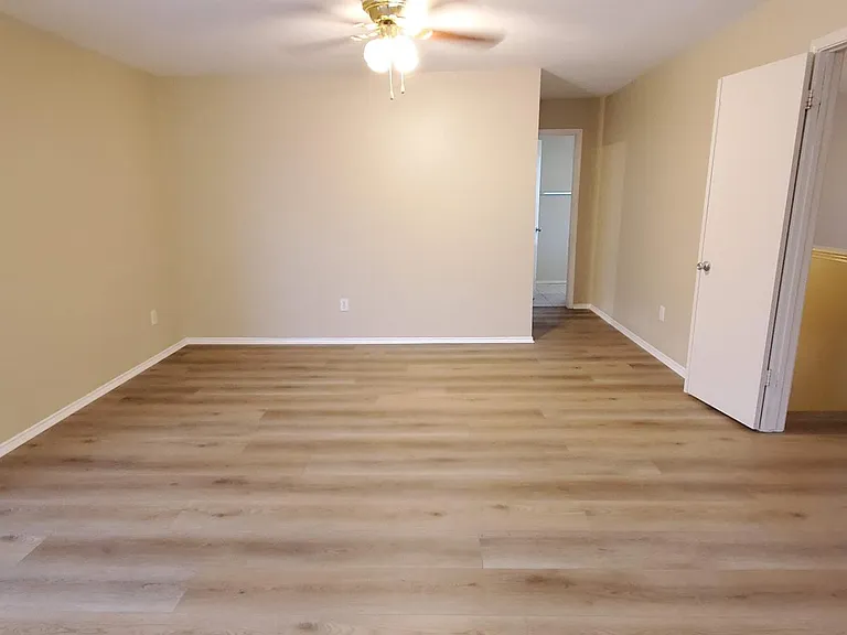 Main Bedroom at top of stairs with French doors. It's massive.