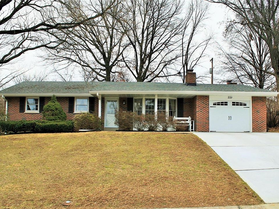 CURB APPEAL AT ITS BEST W/ NEWER ROOF, GUTTERS & CARRIAGE GARAGE DOOR!