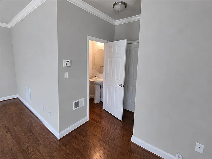 First floor half bath and entrance to the 2 car garage.