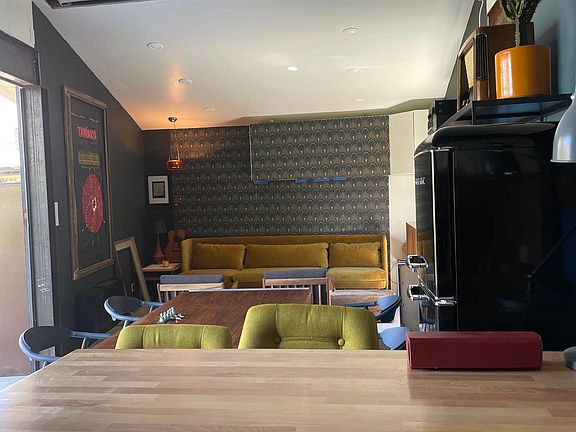 FROM KITCHENETTE LOOKING TO DINING AND LIVING SPACE