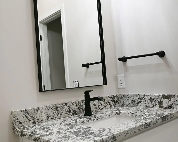 Modern half bathroom at Lyric Townhomes.