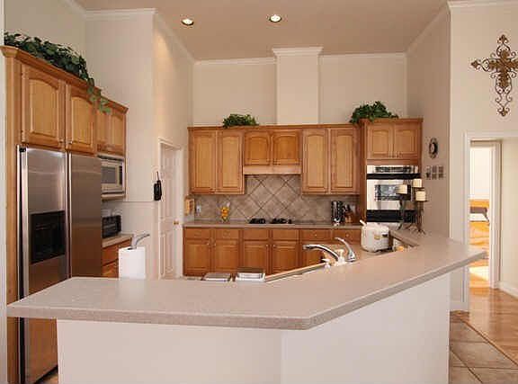 Open kitchen w/ stainless steel appliances