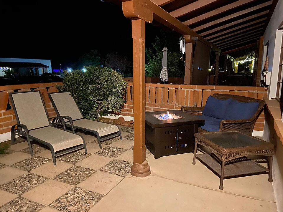 Large patio with comfortable seating and beautiful gas fireplace.