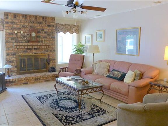 Cozy fireplace in this large Den with Tile Floors