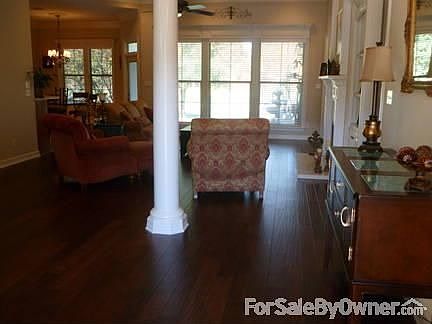 Entry way into den
						:
						Real, handscraped hardwood floors in entry way, den, dining room