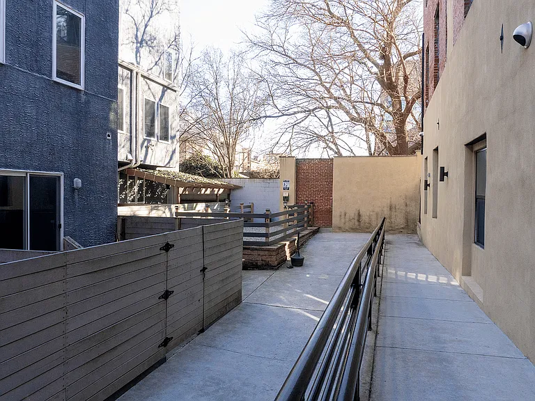 Enjoy the tranquility of this charming urban patio, perfect for relaxation.