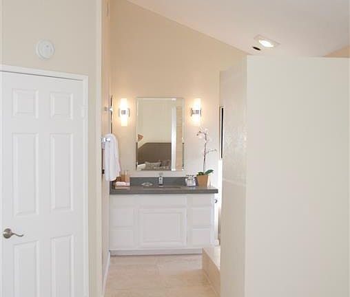 Main bathroom is exposed to bed