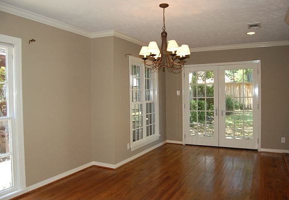 Formal dining room features French doors to backyard