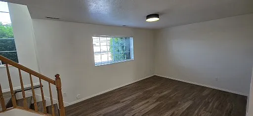 Living Room and Stairs to Entry