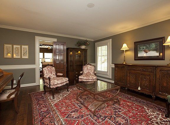 Formal living room with decorative trim