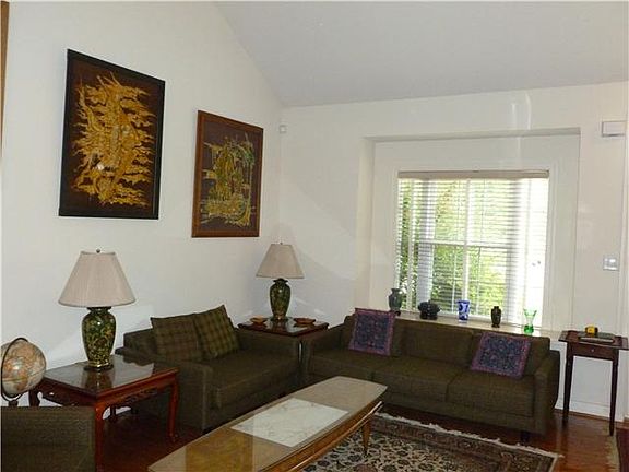 Hardwood flooring & window seat  in living room.