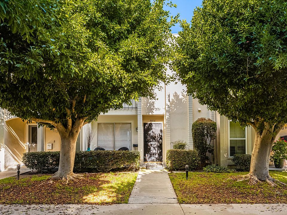 Front door of townhome opens out onto greenbelt. No noisy cars. (Other access from attached 2-car garage.)